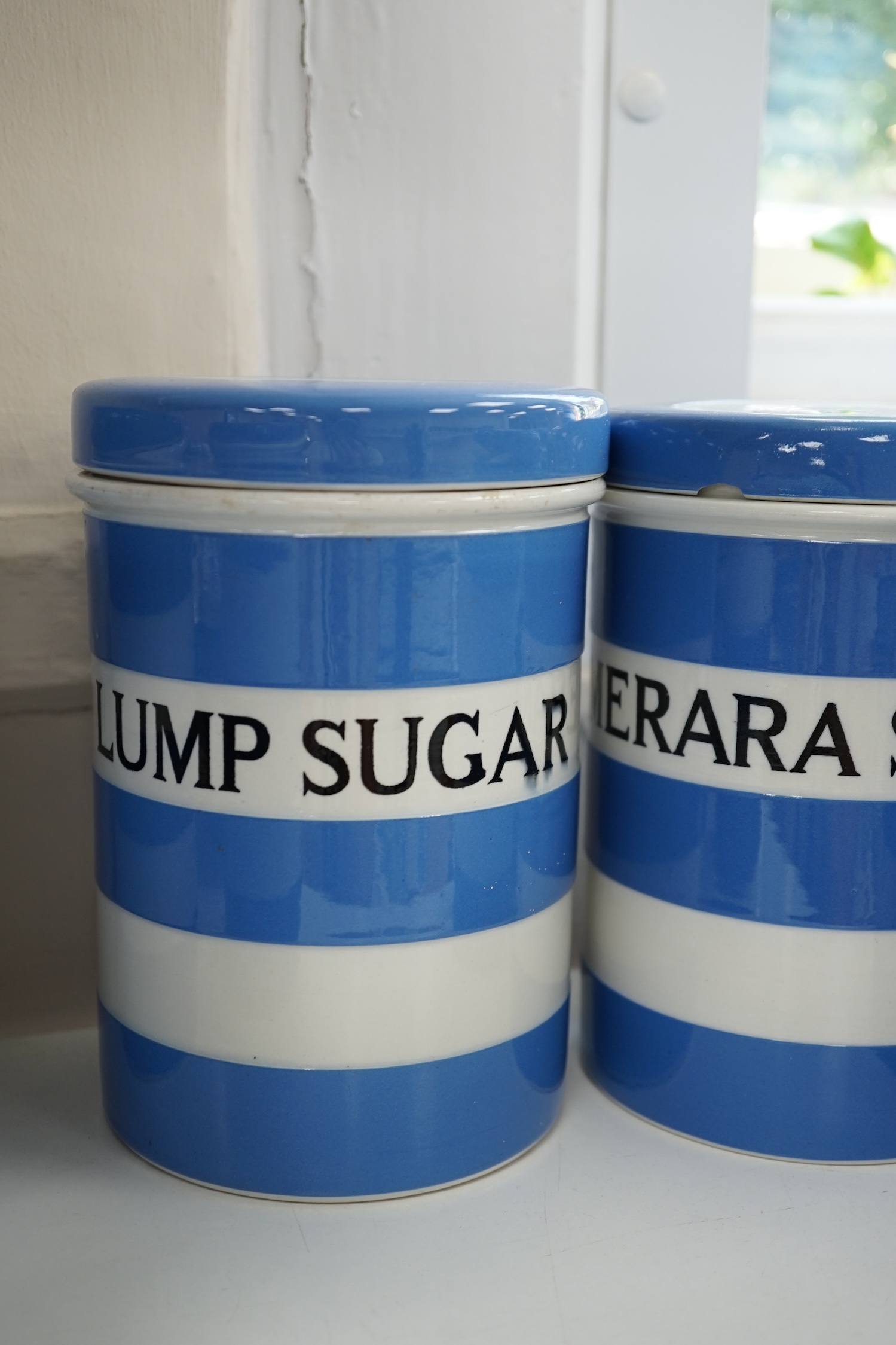 T.G.Green Cornish Kitchenware, ten 17cm lidded storage jars to include Tapioca, Dried Fruit, Sultanas, Lump Sugar and Flour, Black Shield marks. Condition - fair to good